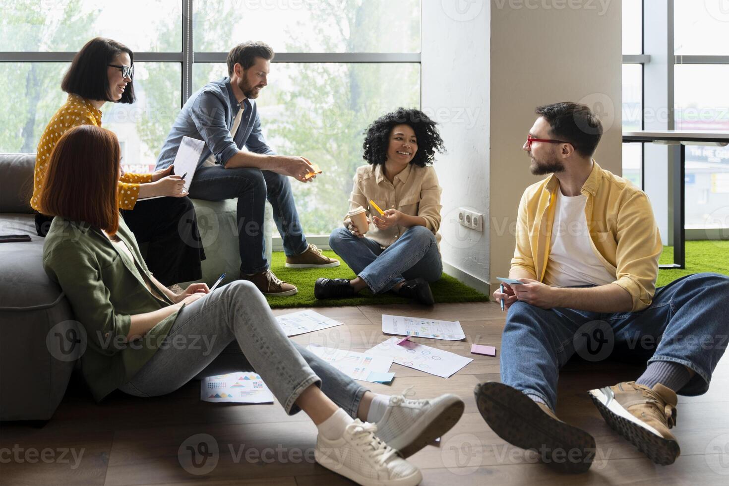 Diverse team brainstorming during creative business meeting photo