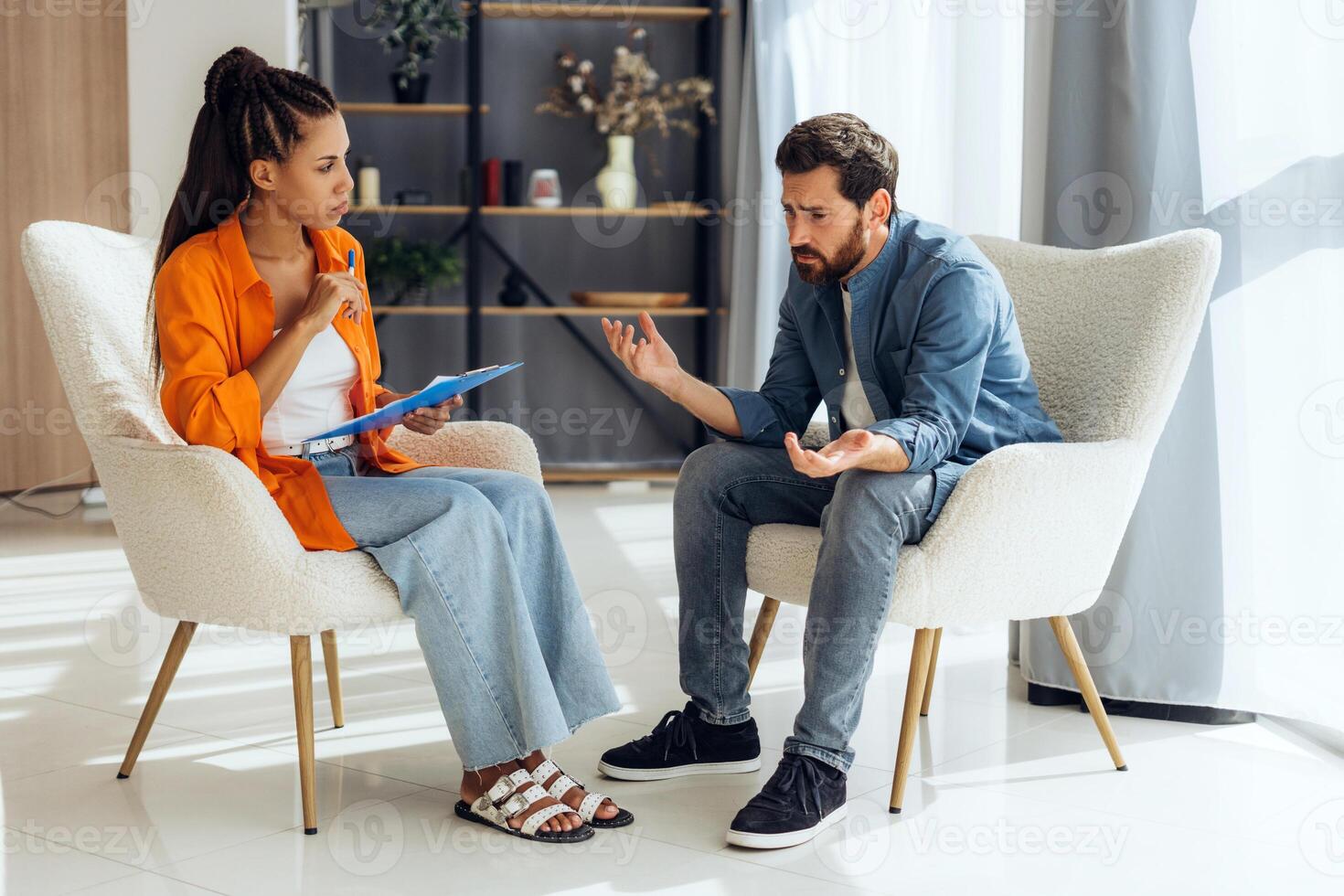 Upset man at visit to psychotherapist, have problems in relationship in modern office together photo