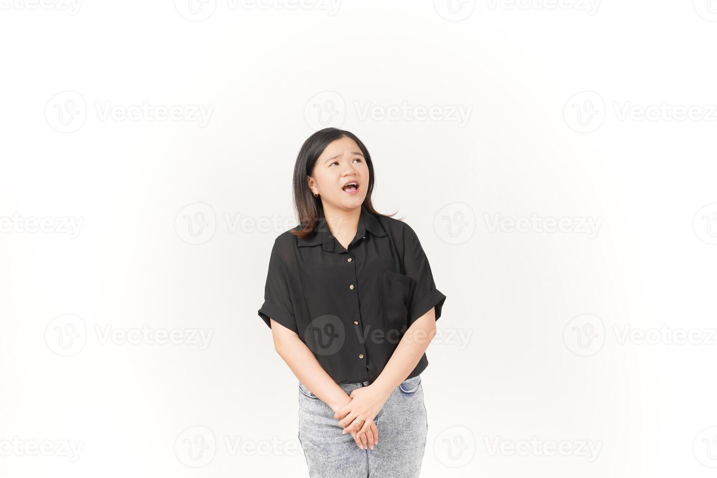 beautiful Asian woman turns to the side, looking intently and shouting, with a dramatic expression against a white background photo