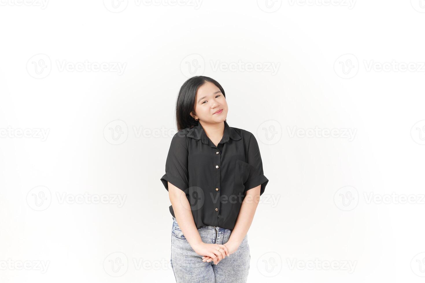 beautiful Asian woman smiles warmly, striking a cute, playful pose against a plain white background photo