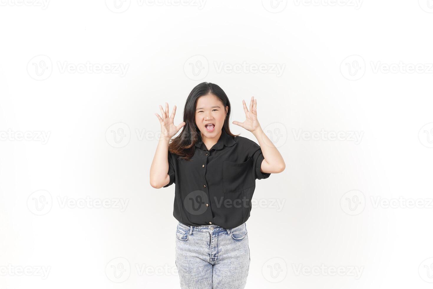 beautiful Asian woman in an angry pose, shouting with frustration, her intense expression clear against a white background photo