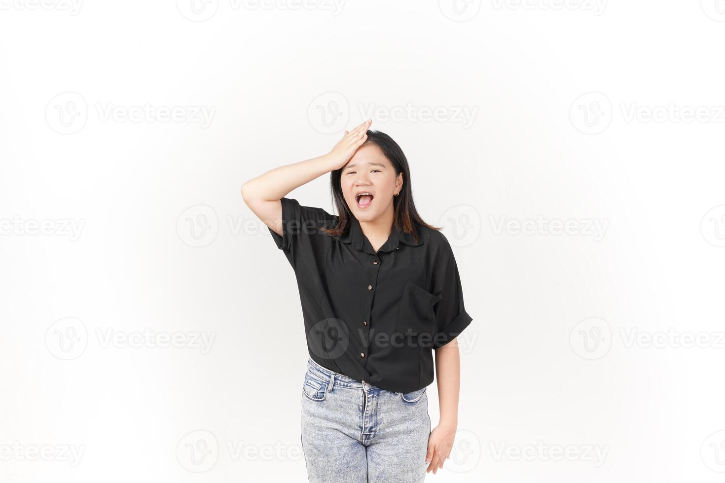 beautiful Asian woman holds her head in pain, with a pained expression showing signs of a headache against a white background photo