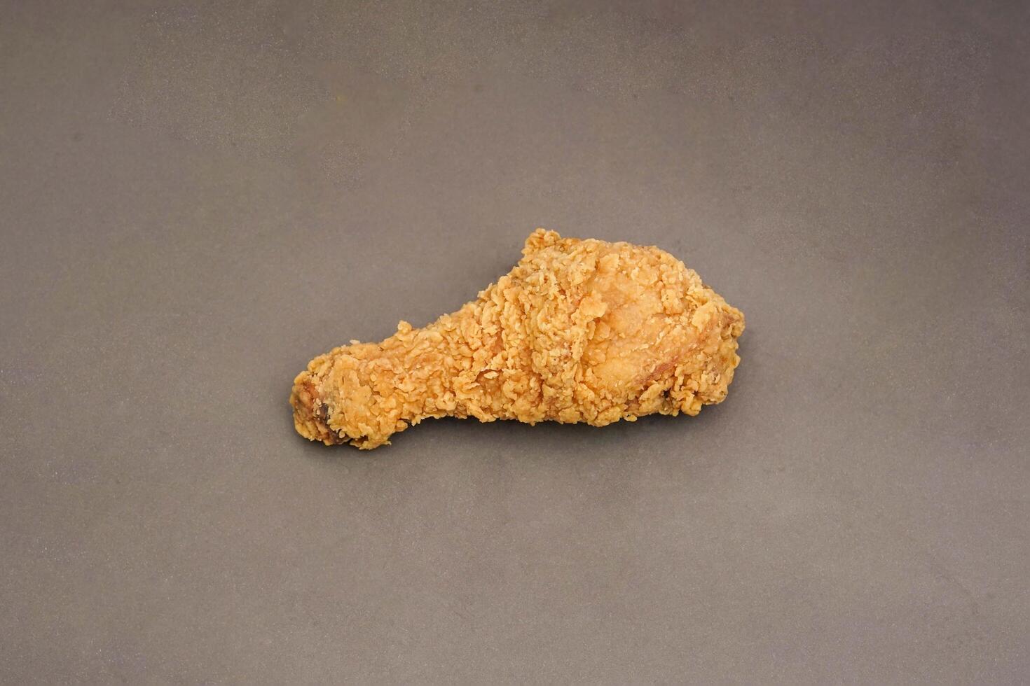 Fried Chicken breast hot crispy strips crunchy chicken tenders three pieces isolated on black background. Crispy fried chicken is a food made from fried chicken placed on a plate. photo