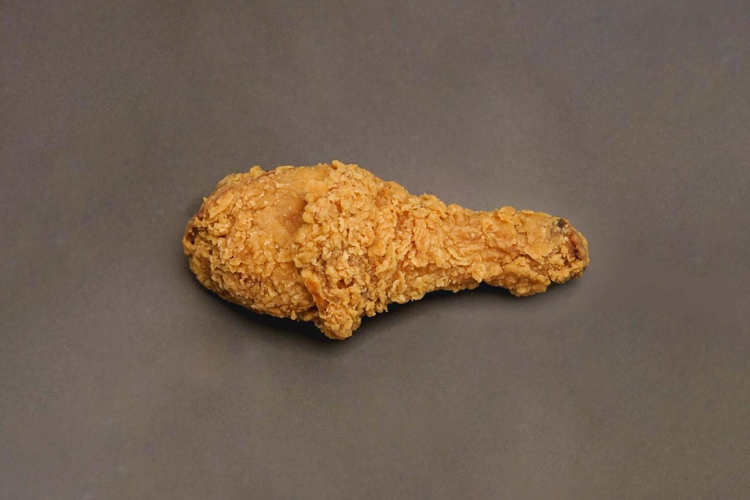 Fried Chicken breast hot crispy strips crunchy chicken tenders three pieces isolated on black background. Crispy fried chicken is a food made from fried chicken placed on a plate. photo