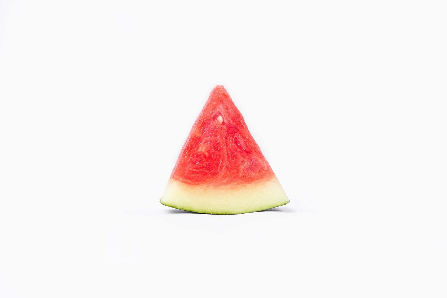 Whole watermelon and seeded slices seen front and top on a white background. Watermelon slices are red, seedy and juicy. photo