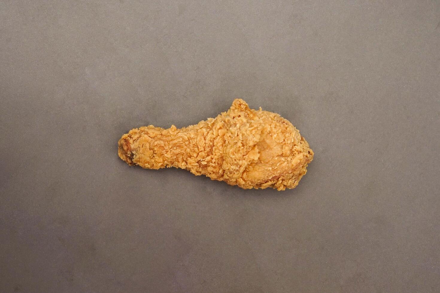 Fried Chicken breast hot crispy strips crunchy chicken tenders three pieces isolated on black background. Crispy fried chicken is a food made from fried chicken placed on a plate. photo