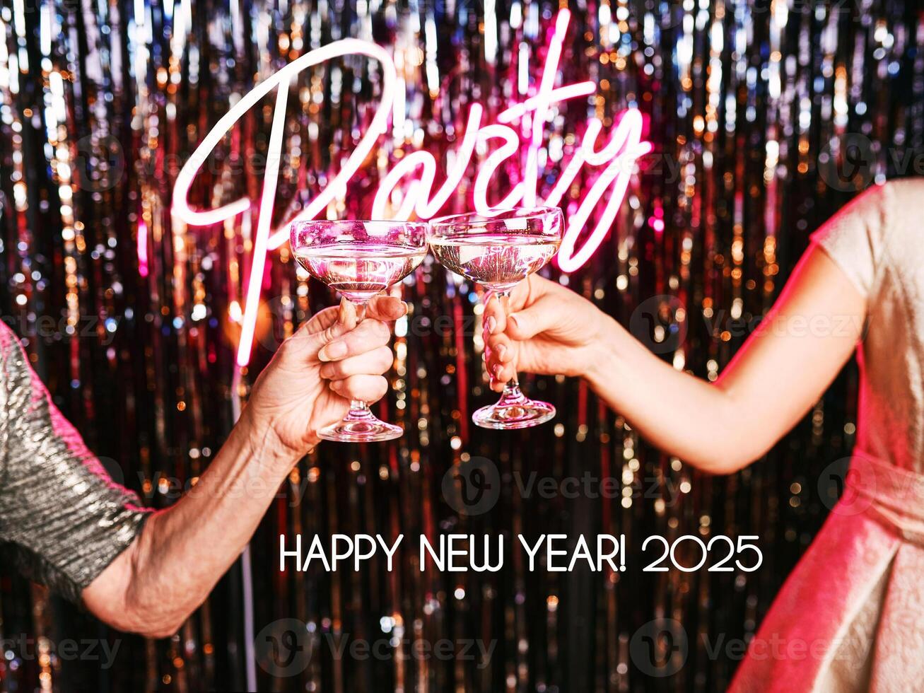 two hands of mature women drinking sparkling wine at the party. Holidays, life event, celebration photo