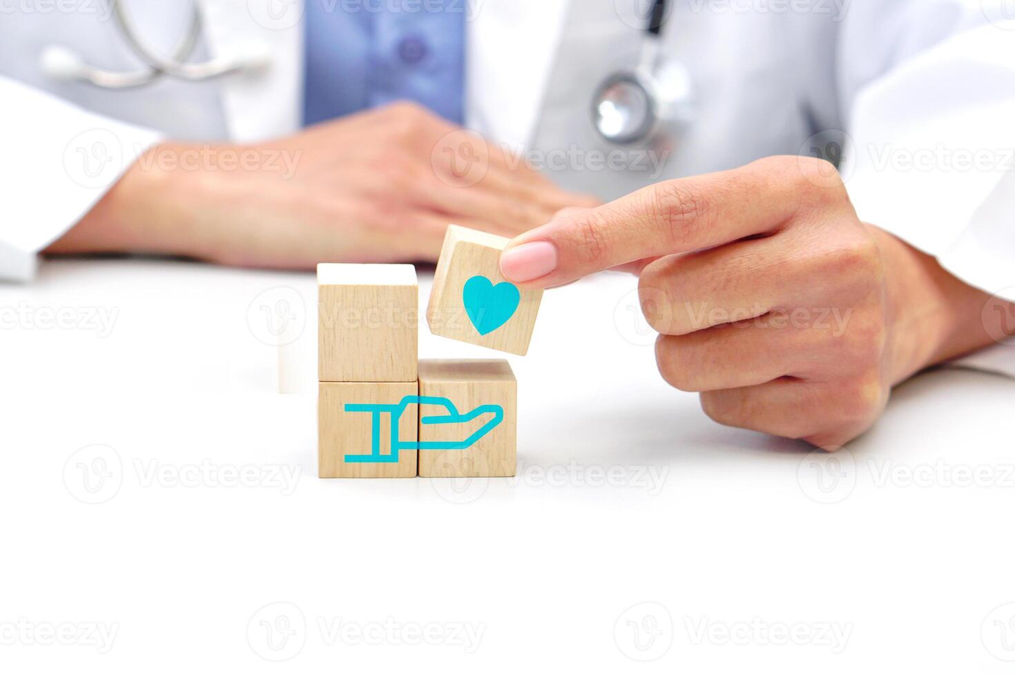 Hand holding a wooden block cube with healthcare medical icon symbol. Medical and health concept. photo