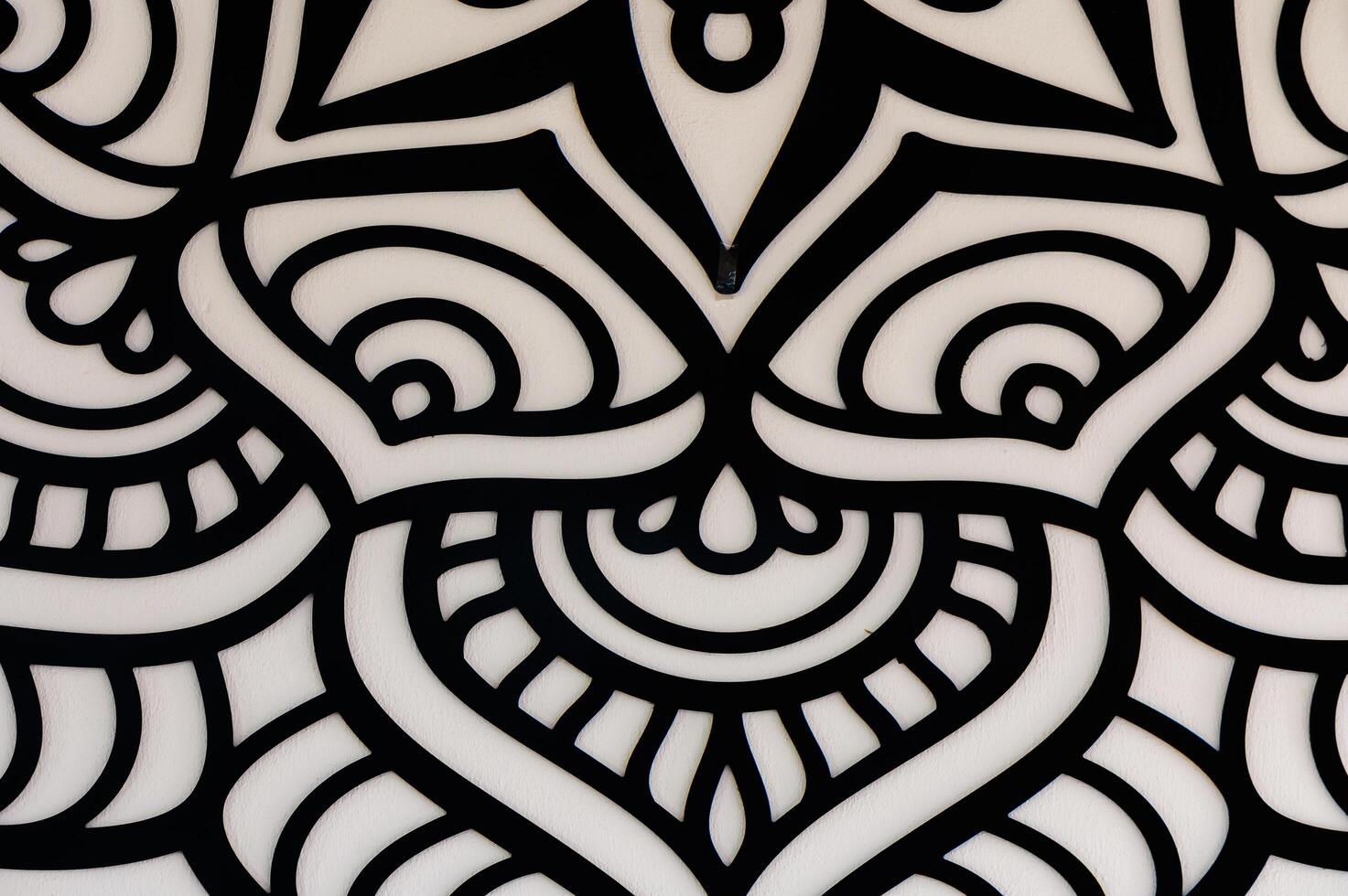 Intricate Black and White Abstract Design Featuring Swirling Patterns and Shapes, Captivating Viewers With Its Mesmerizing Detail and Symmetry photo