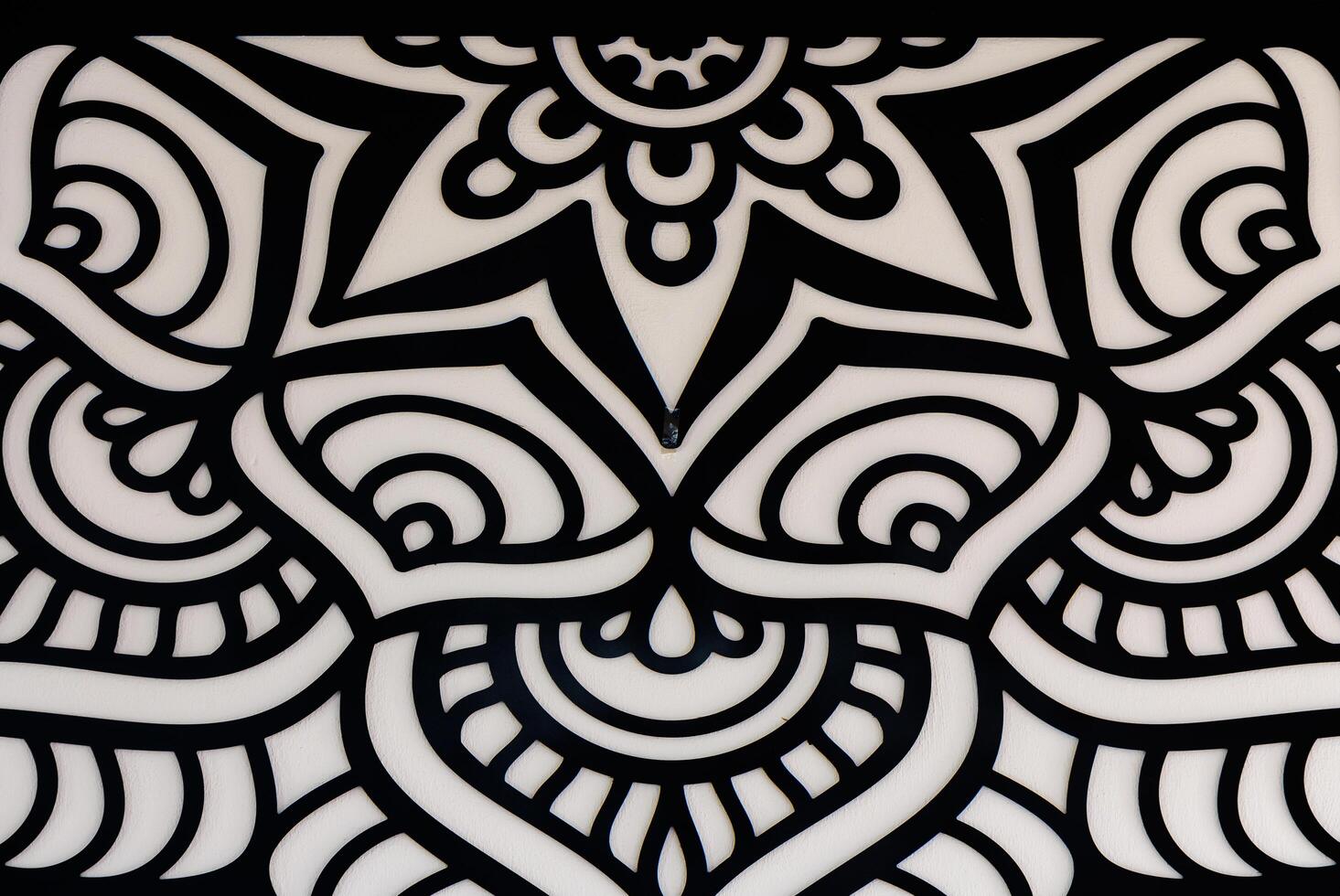 Intricate Black and White Mandala Design Filled With Swirls and Curves, Showcasing Artistic Creativity and Detail in the Artwork photo