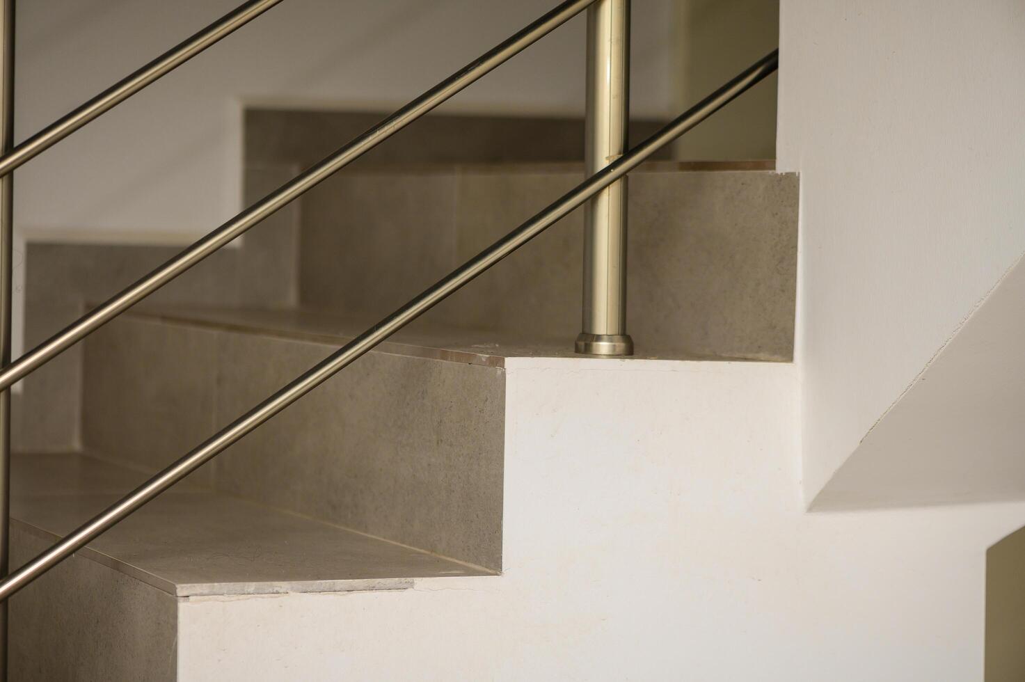 Elegant Staircase Design Featuring Sleek Railings and Minimalist Decor in a Modern Interior Space During Daytime photo