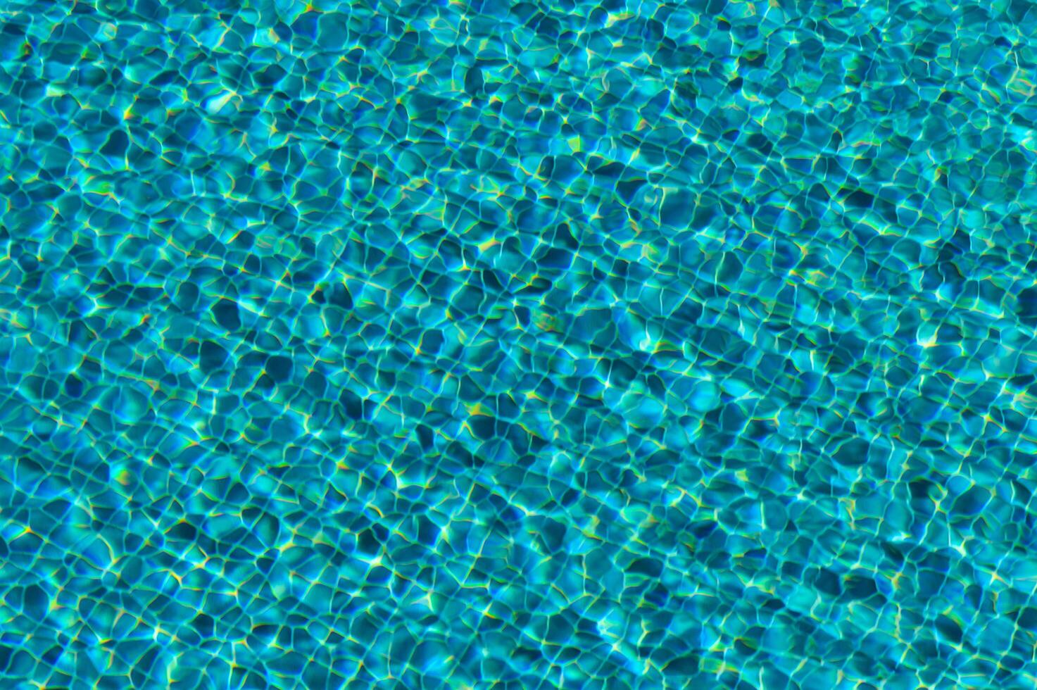 Rippling Azure Waters Gleam Under the Sun, Casting Dancing Reflections Across the Shimmering Surface of a Tranquil Pool photo