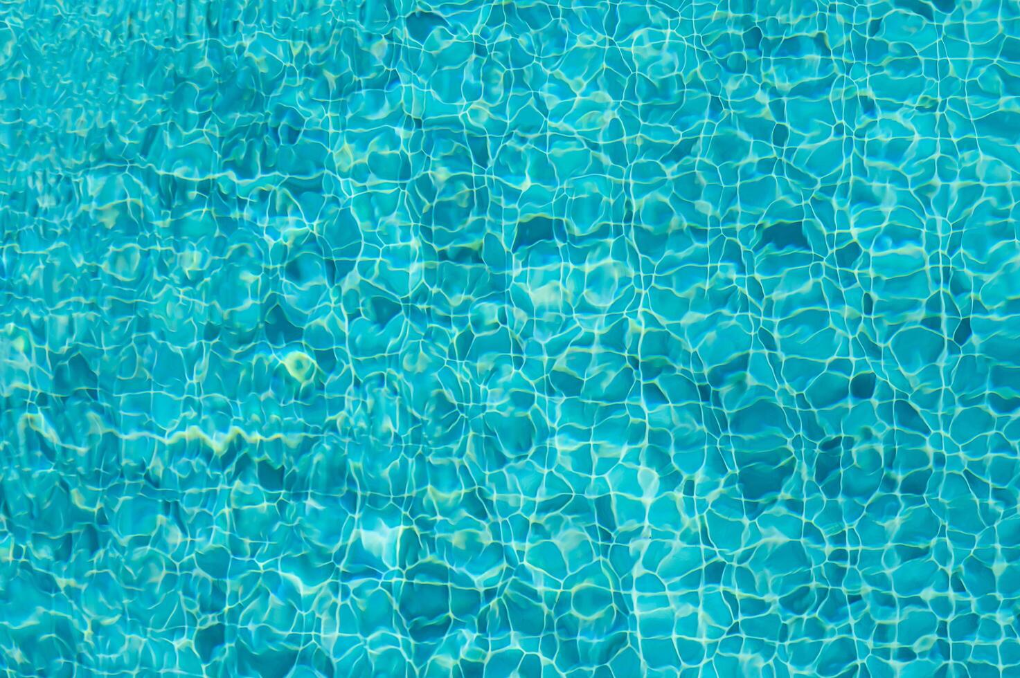 Captivating Reflections on Crystal-Clear Water Creating Mesmerizing Patterns Under Bright Sunlight photo