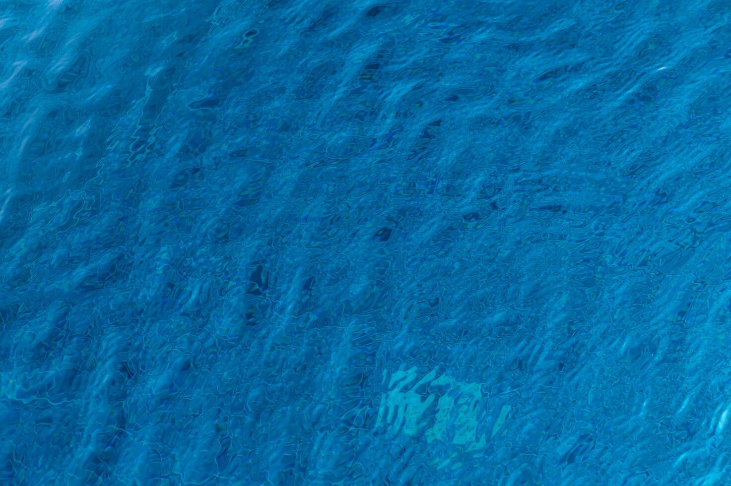 Crystal Clear Turquoise Waters Reflect Sunlight, Showcasing Vibrant Aquatic Life Beneath the Surface in a Serene Marine Paradise photo