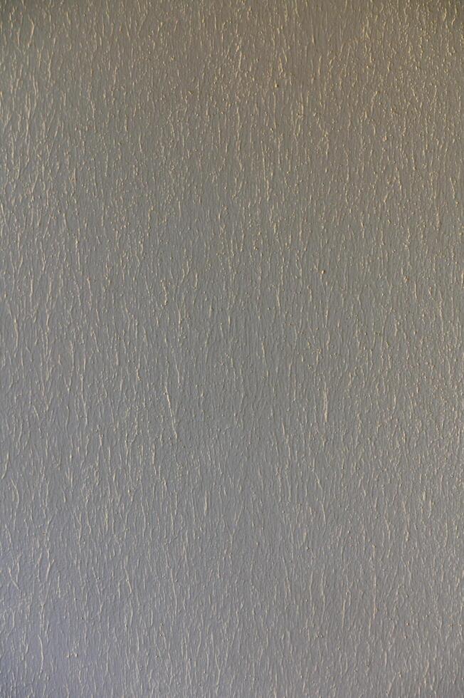 Textured Wall With Subtle Patterns Illuminated by Natural Light in a Serene Indoor Setting During the Afternoon Hours photo