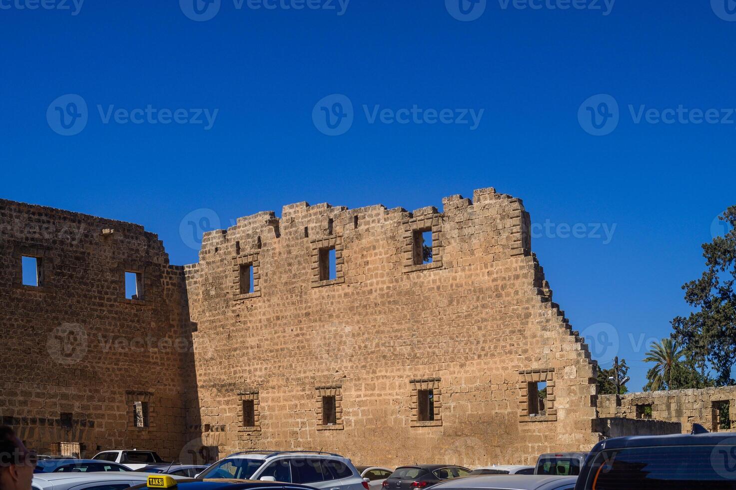 Exploring ancient stone ruins under a bright blue sky in a historic location photo