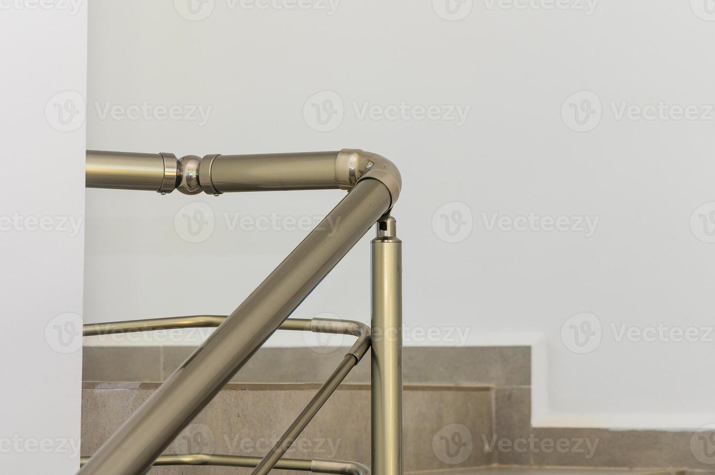 A Close-Up View of a Modern Metal Staircase Railing Highlighting Intricate Design in a Minimalistic Space photo
