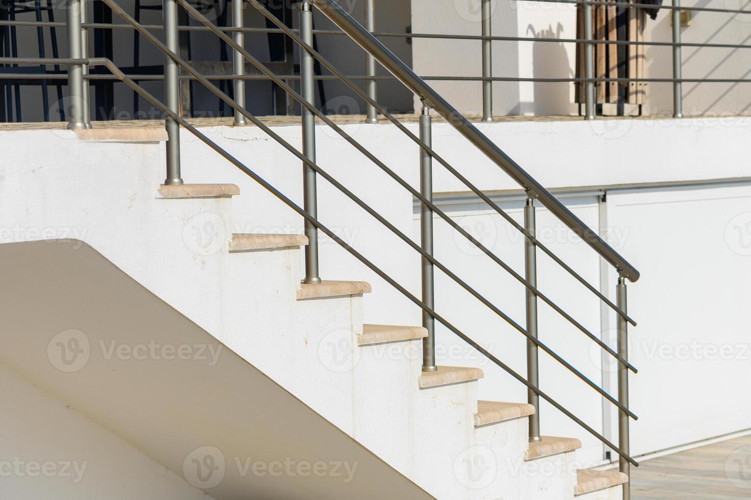 Modern Staircase With Sleek Railings Showcasing Minimalist Design Elements in a Bright Outdoor Setting photo