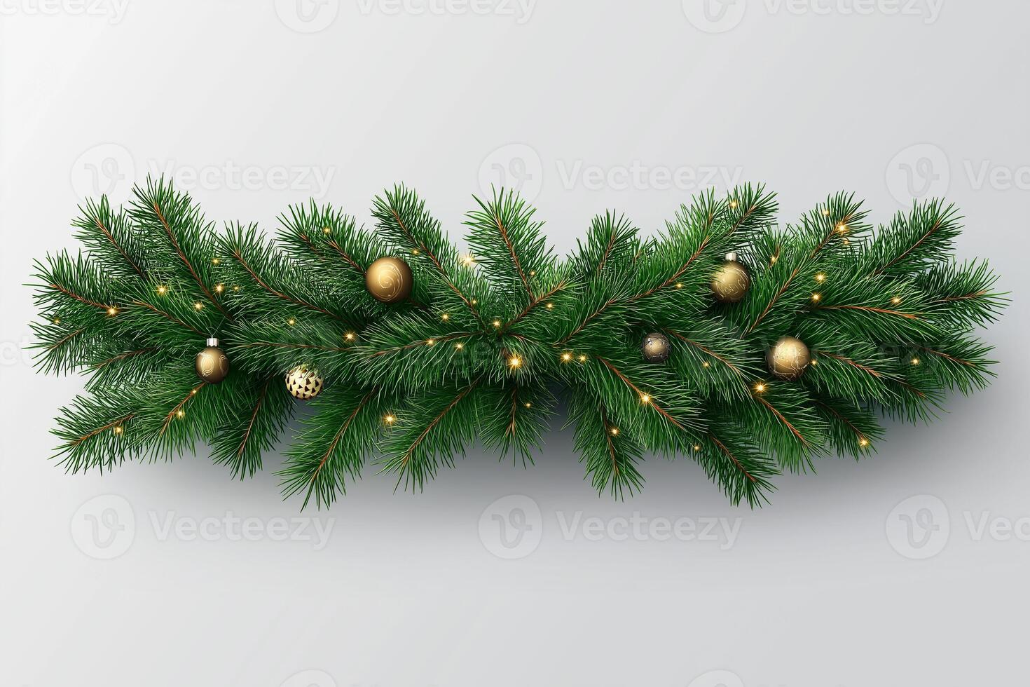 Festive evergreen garland adorned with golden ornaments and lights for holiday celebrations. photo