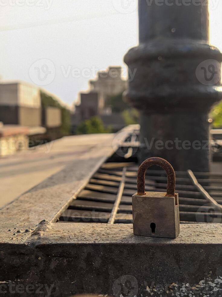 A padlock on a metal railing photo