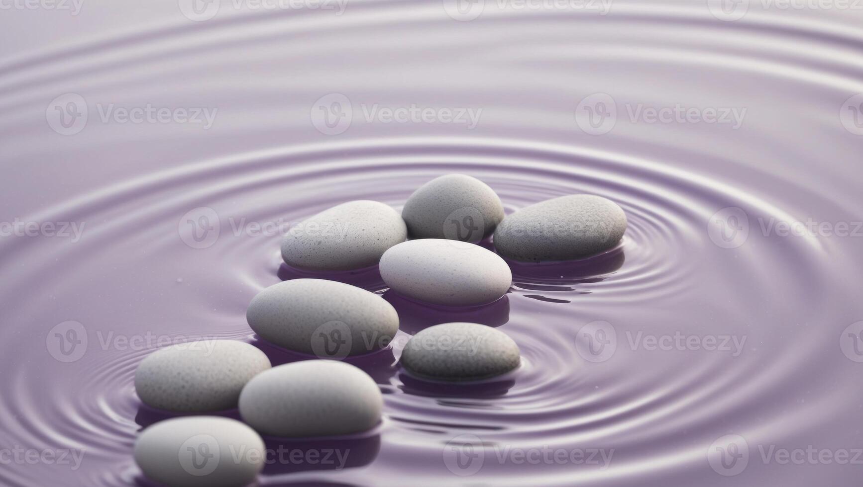 A group of stones in a purple water surface photo