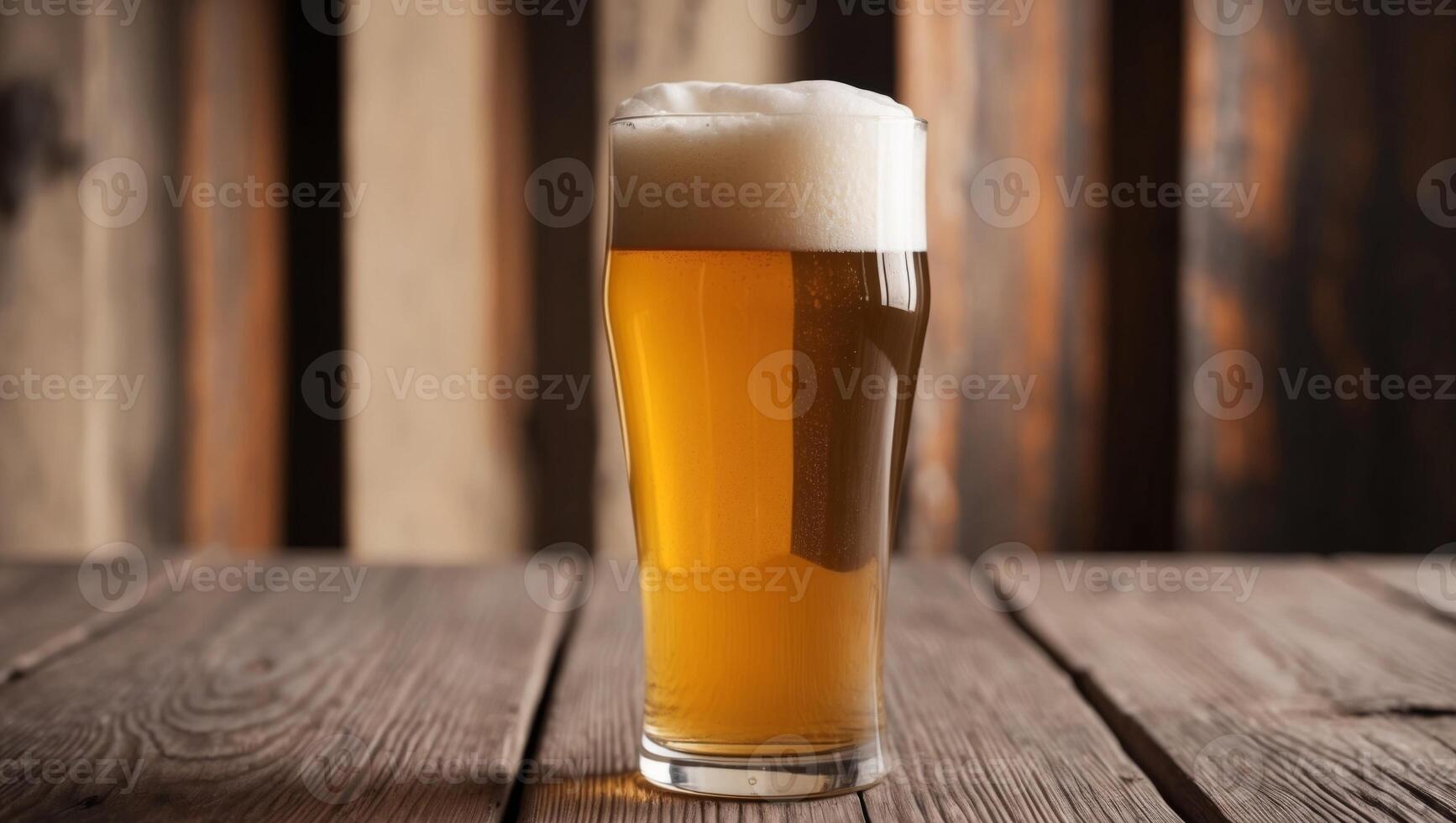 A glass of beer on a wooden table photo