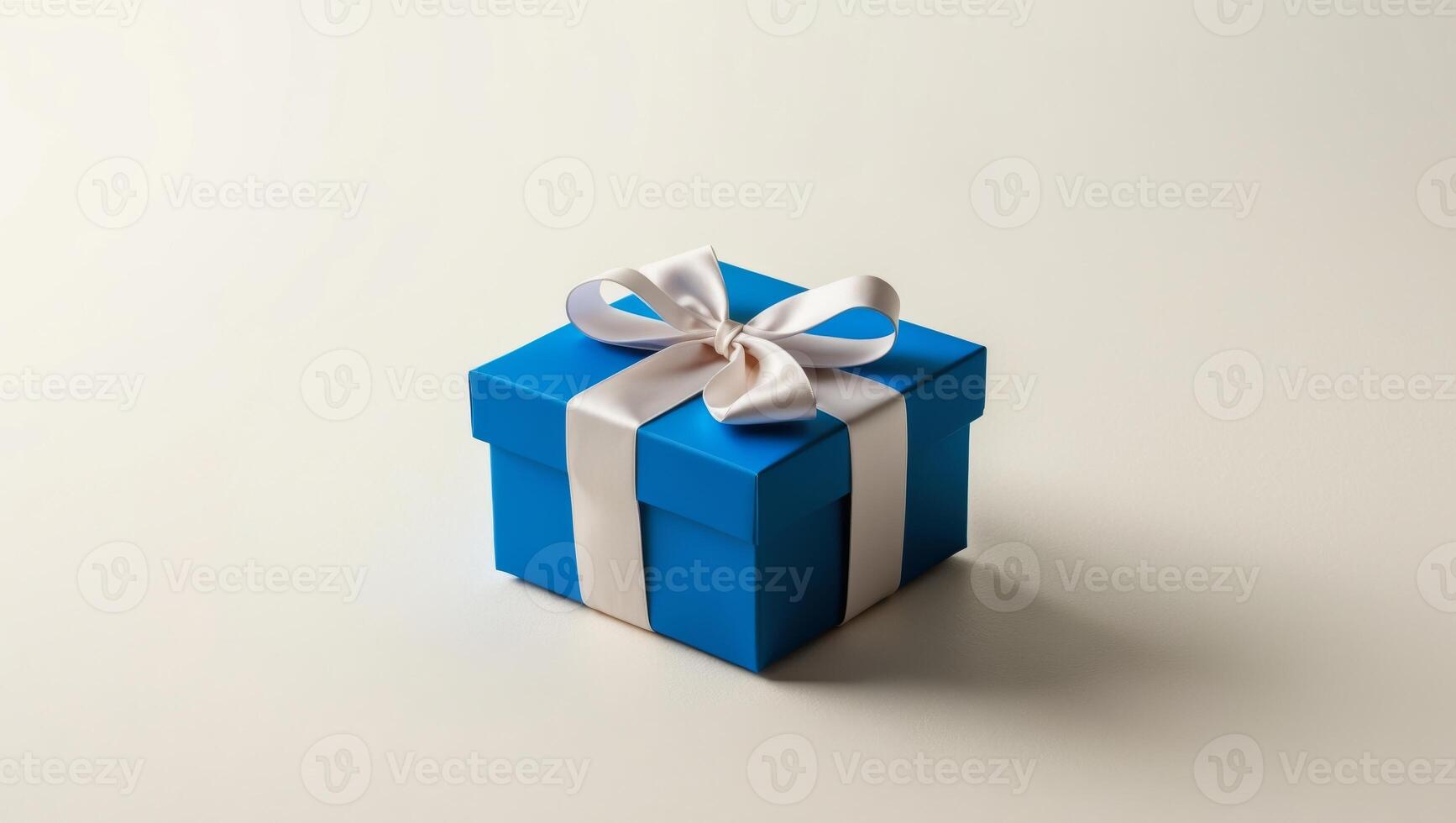 Blue gift box with white ribbon on white background photo