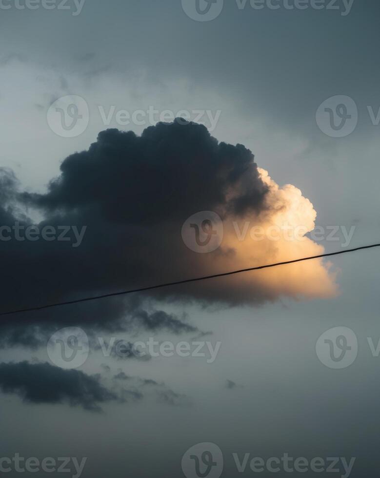 A cloud is seen in the sky above a power line photo