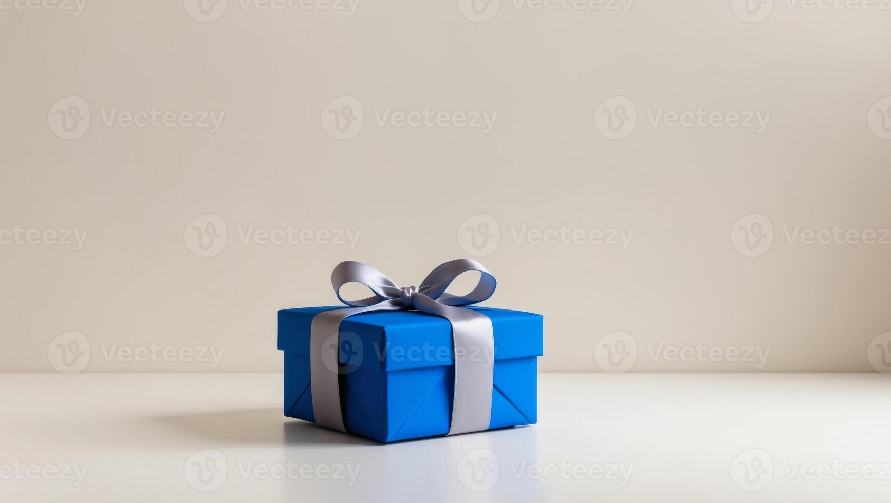 Blue gift box with silver ribbon on white background photo
