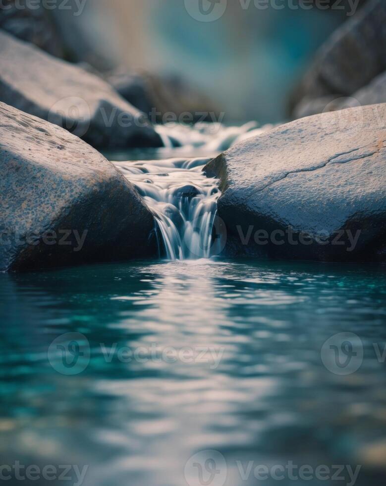 Water flowing over rocks in a stream photo