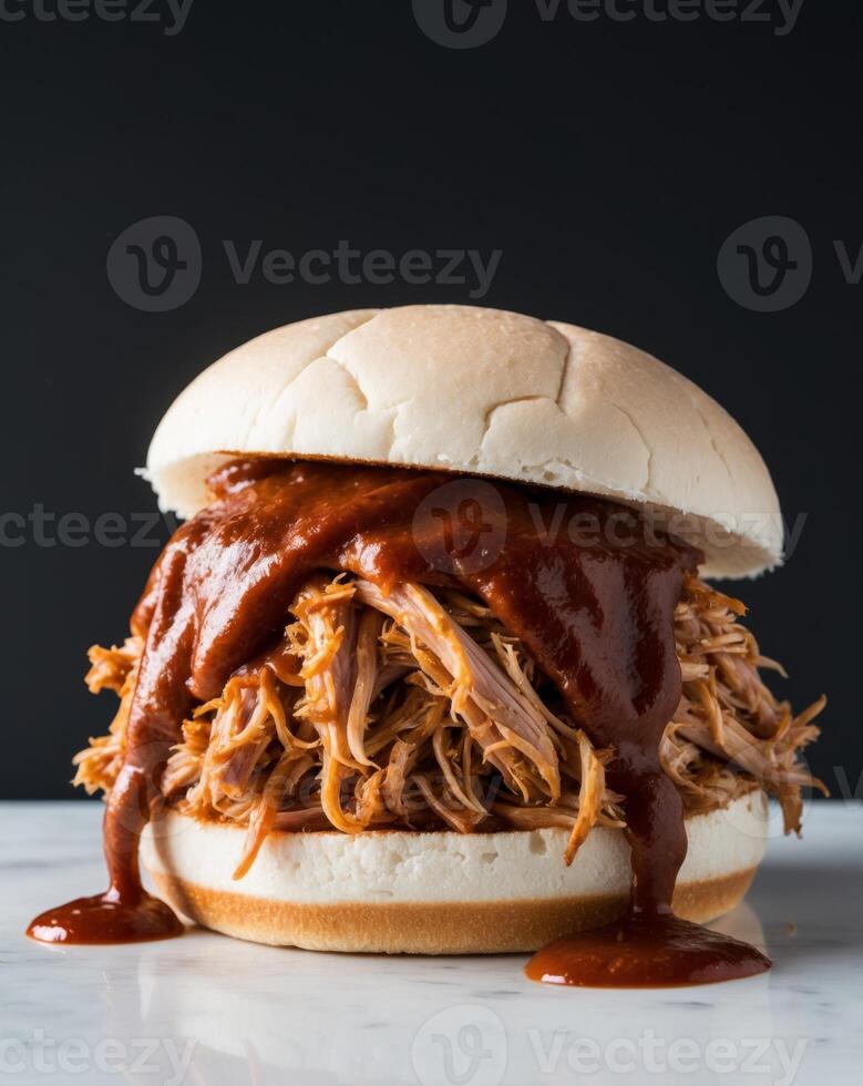 Bbq pulled pork sandwich with bbq sauce photo