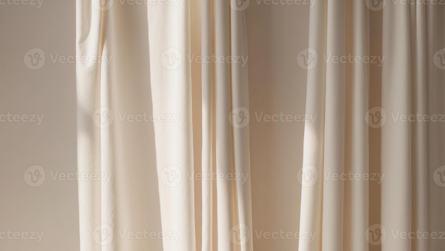 A white curtain is hanging in front of a window photo