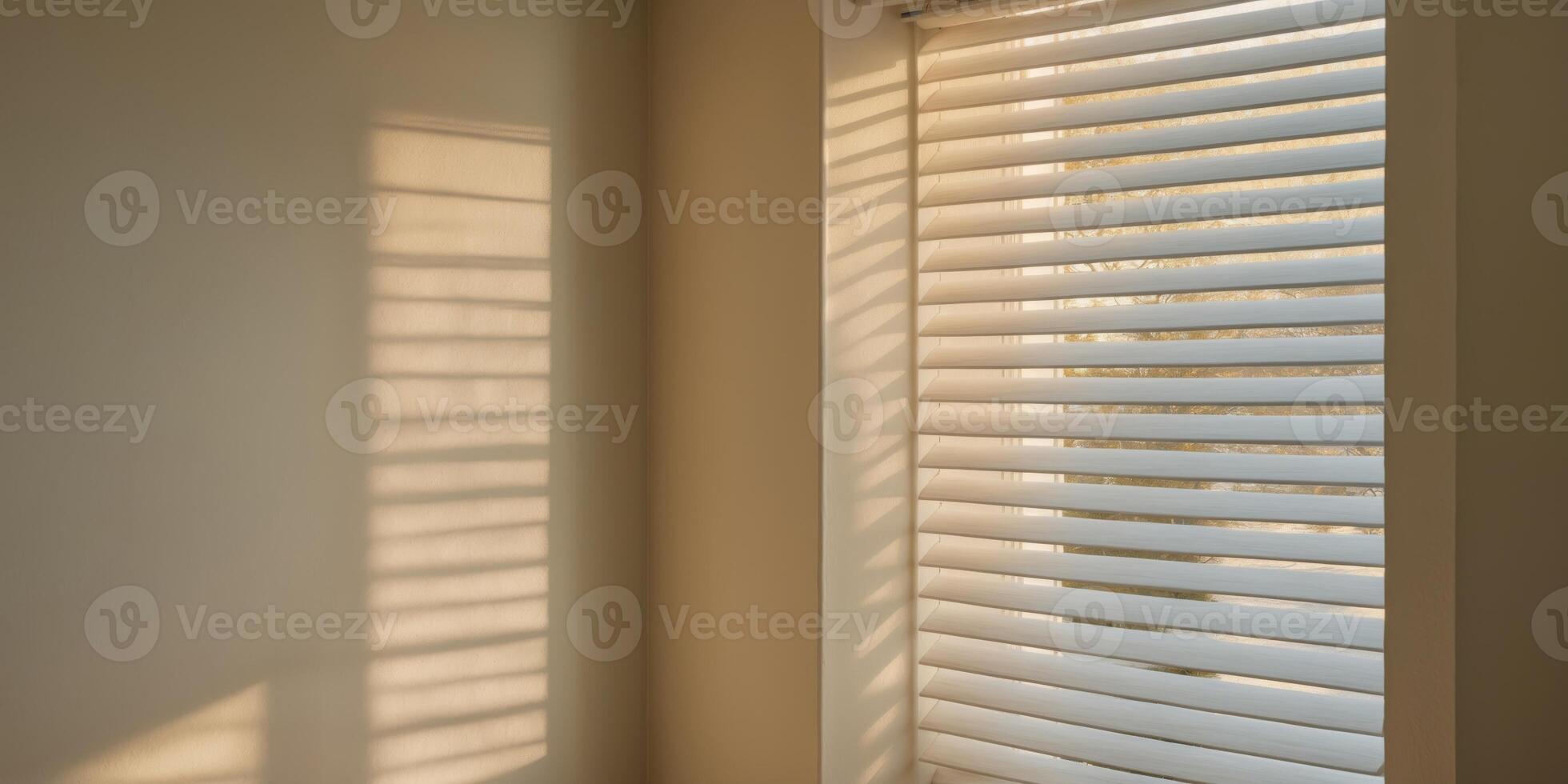 A window with blinds and sunlight coming through photo