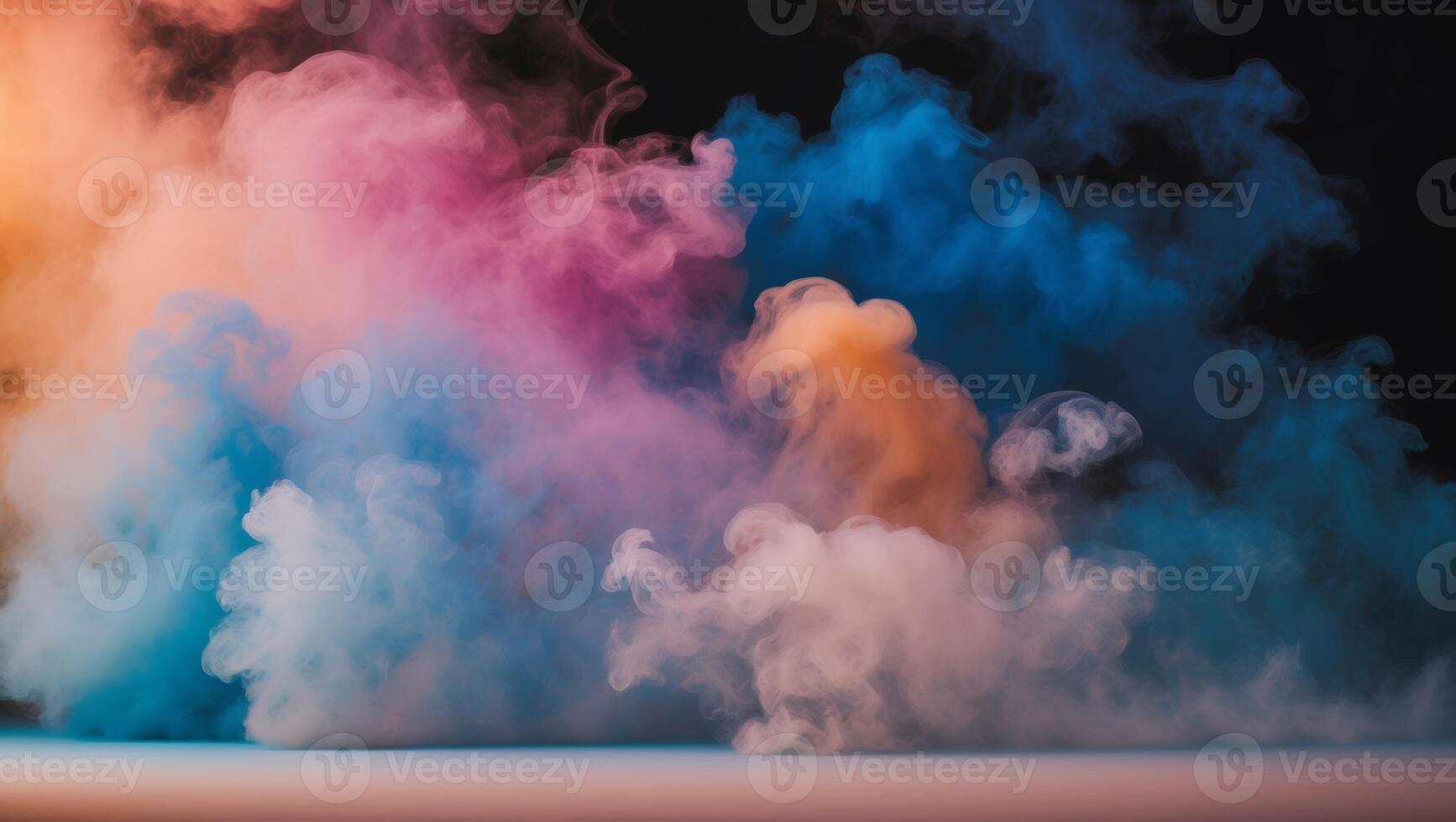 Colorful smoke on a black background photo