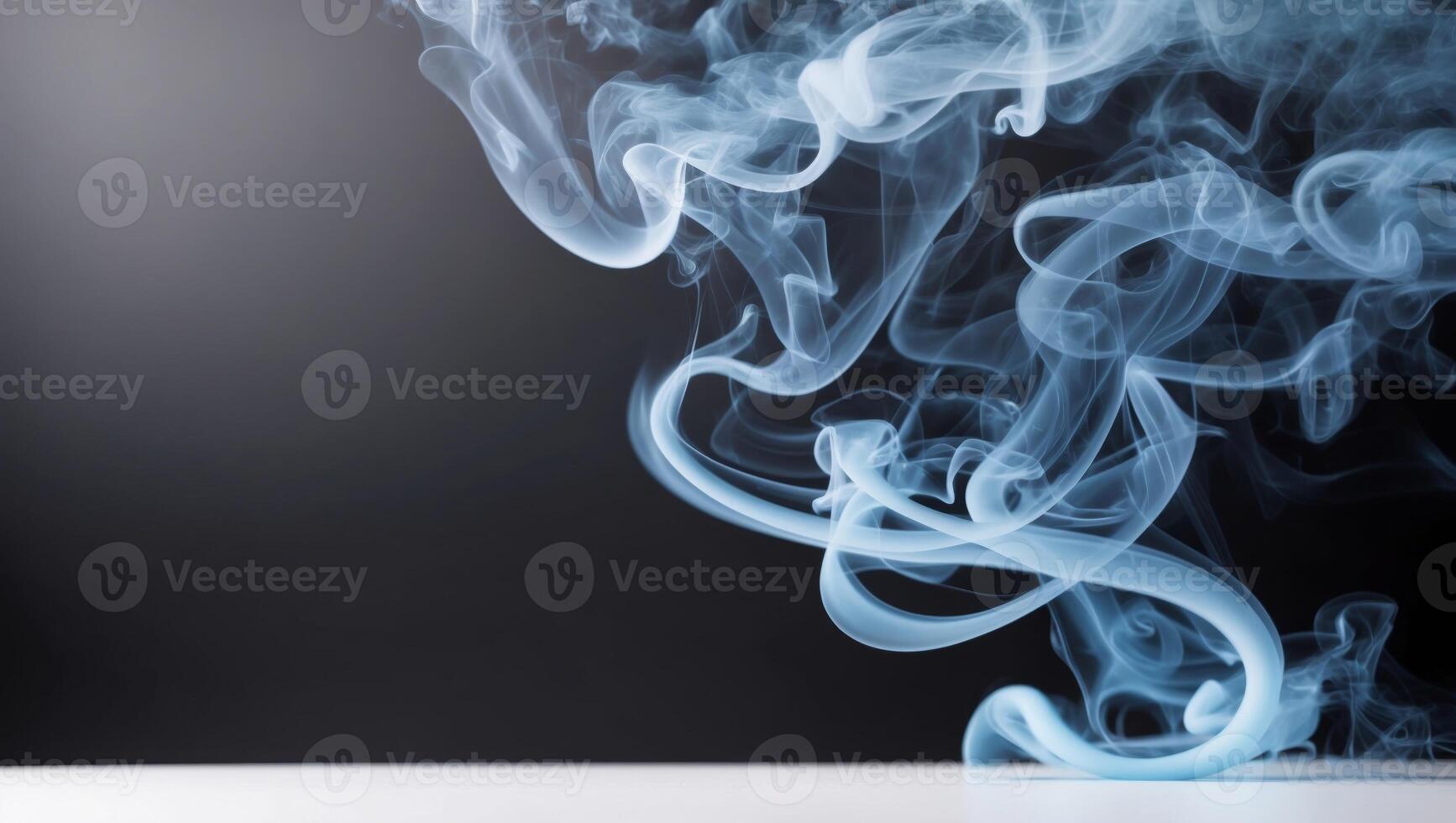 Blue smoke on a white table photo