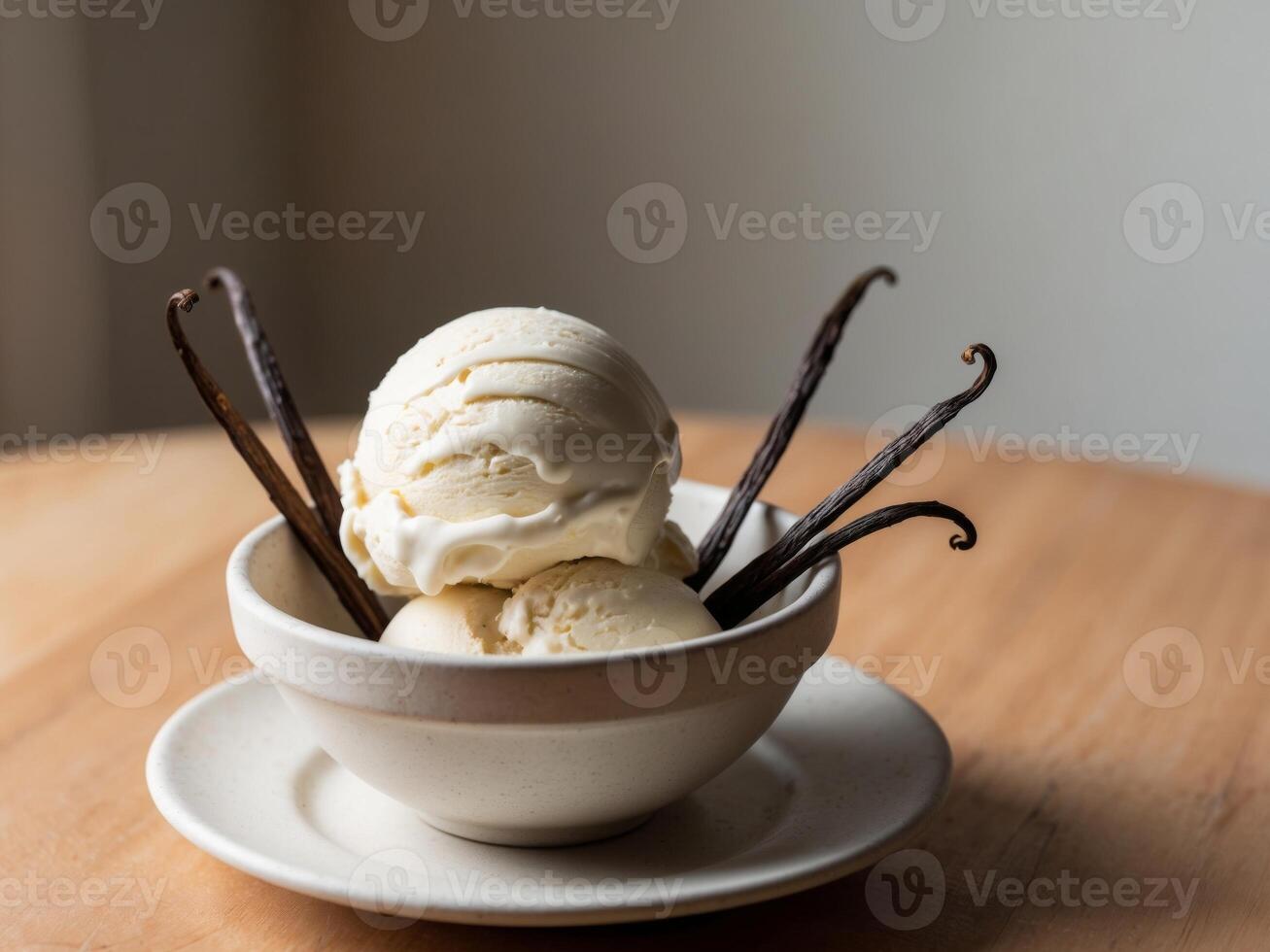 A bowl of vanilla ice cream with two spoons photo