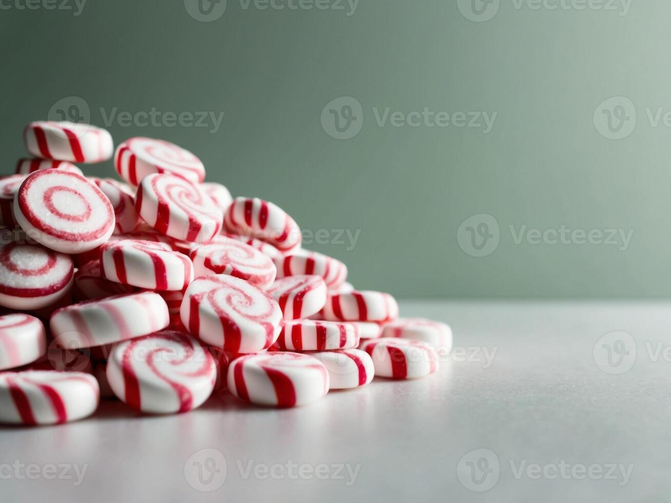 A pile of red and white candy canes photo