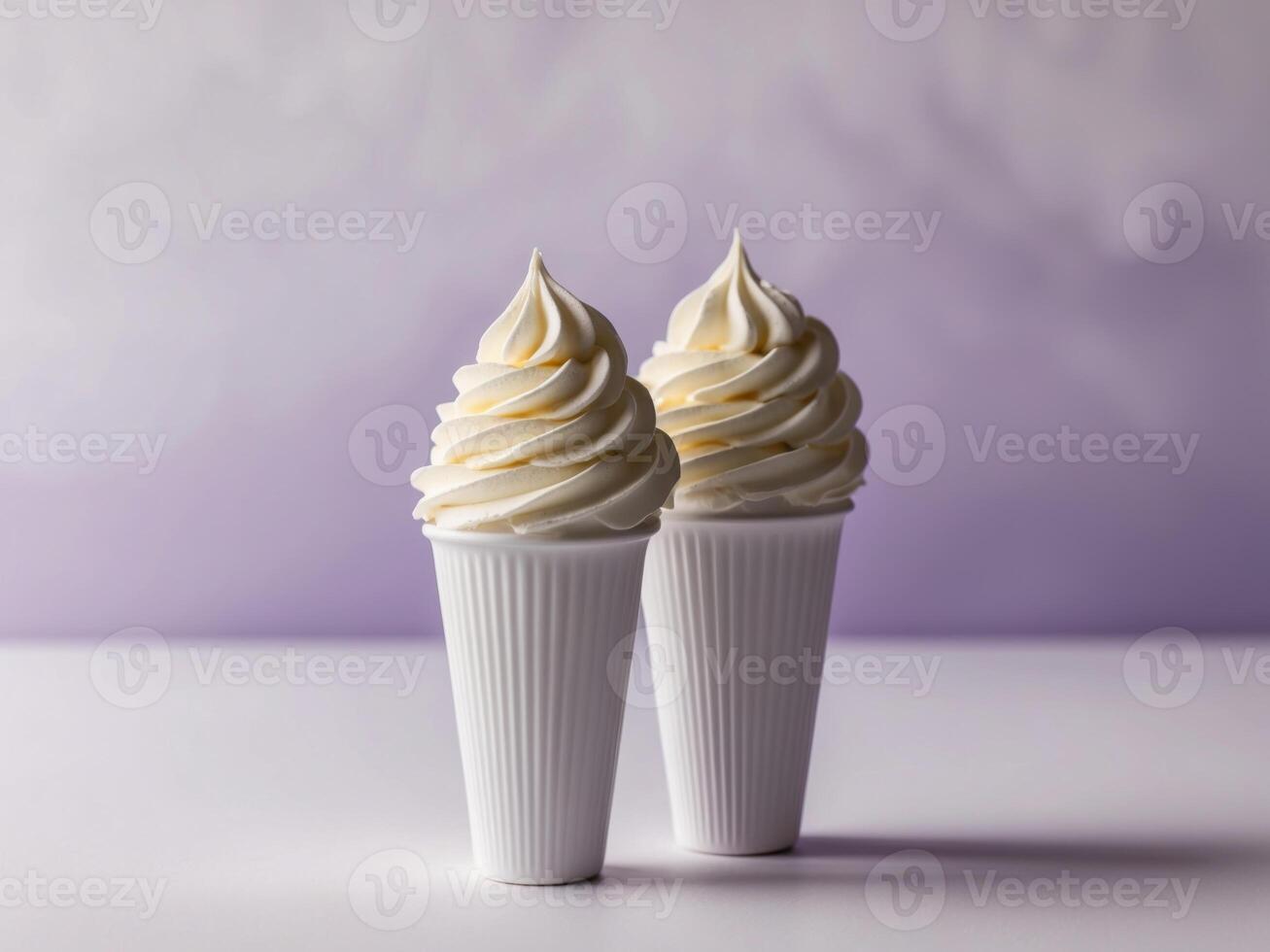 Two ice cream cones with whipped cream on a purple background photo