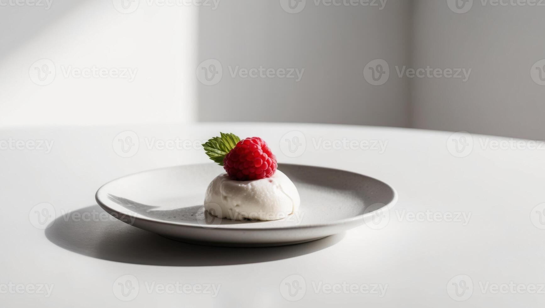 A dessert on a white plate with a strawberry photo