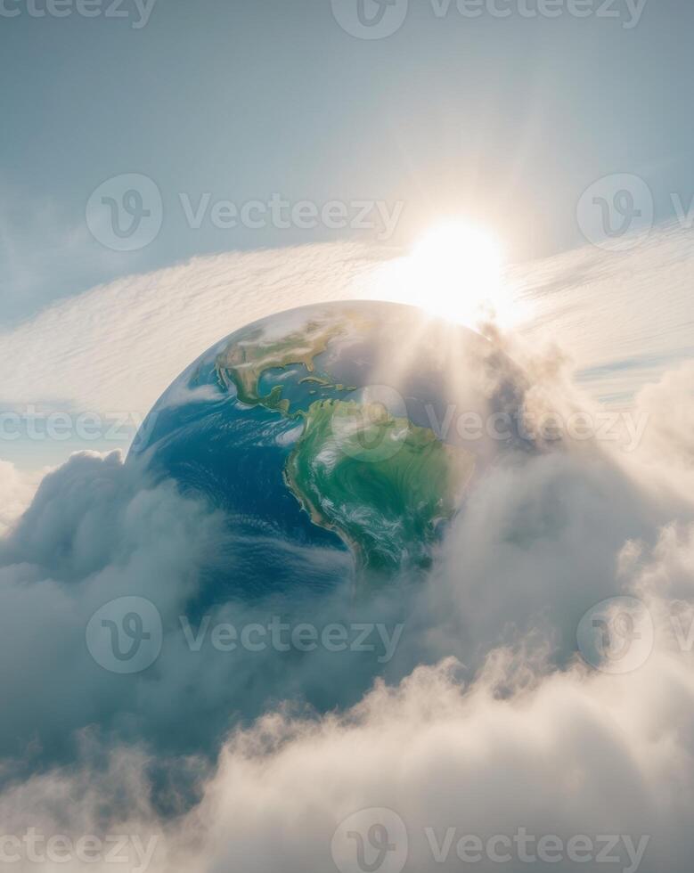 The earth is surrounded by clouds and the sun is shining photo