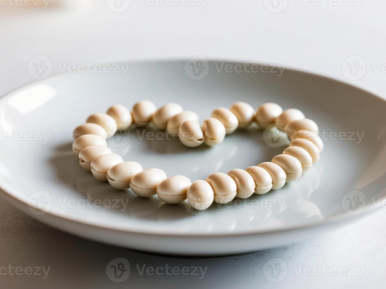 A white plate with a heart shaped cookie photo