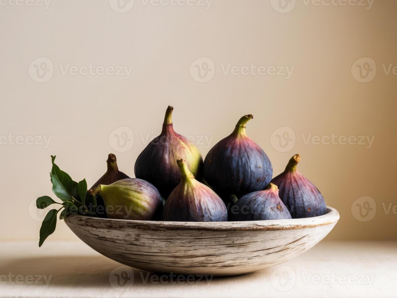Figs in a bowl on a table photo