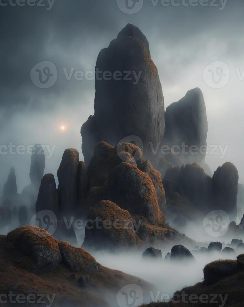 A foggy landscape with rocks and clouds photo