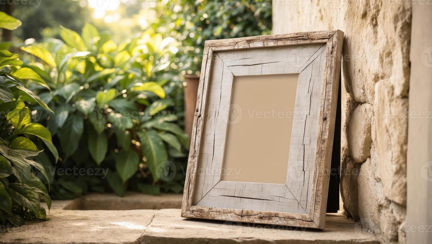 An empty frame sitting on a stone wall photo