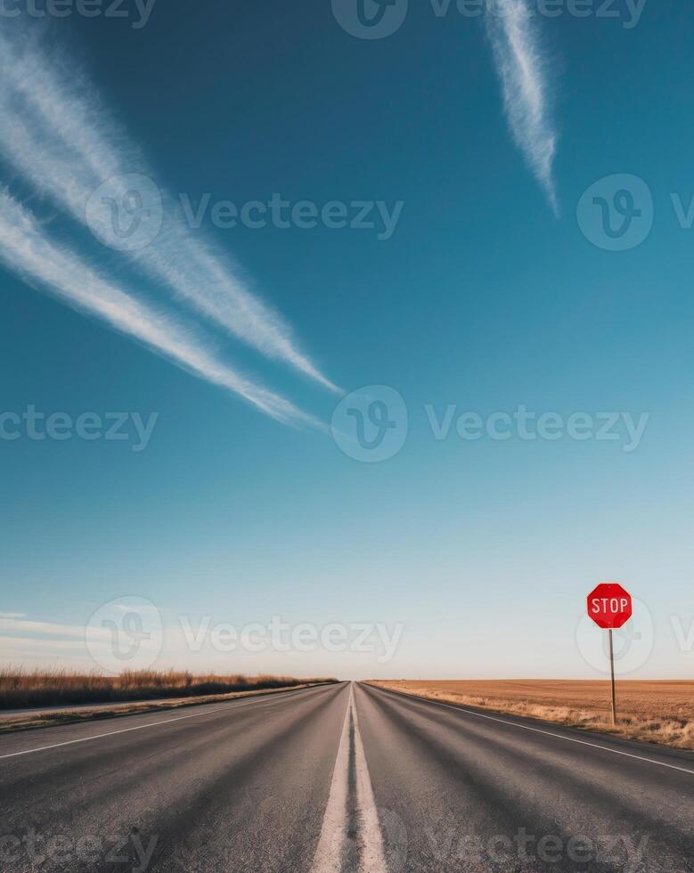 A stop sign on the side of a highway photo