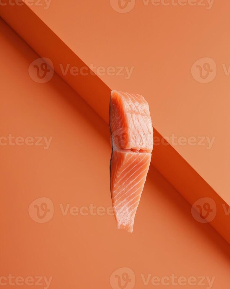 Salmon on orange background photo