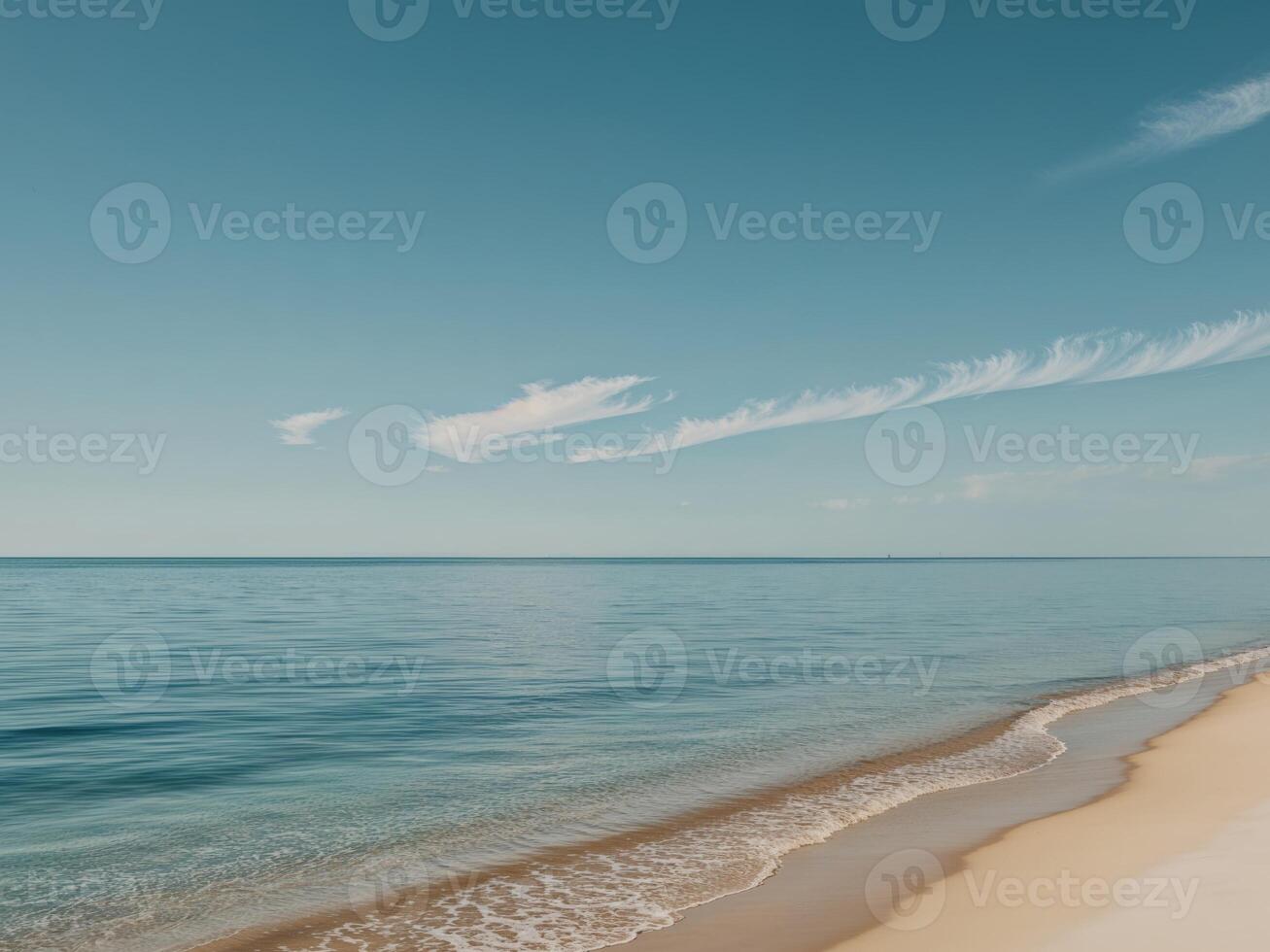 A beach with waves and a blue sky photo