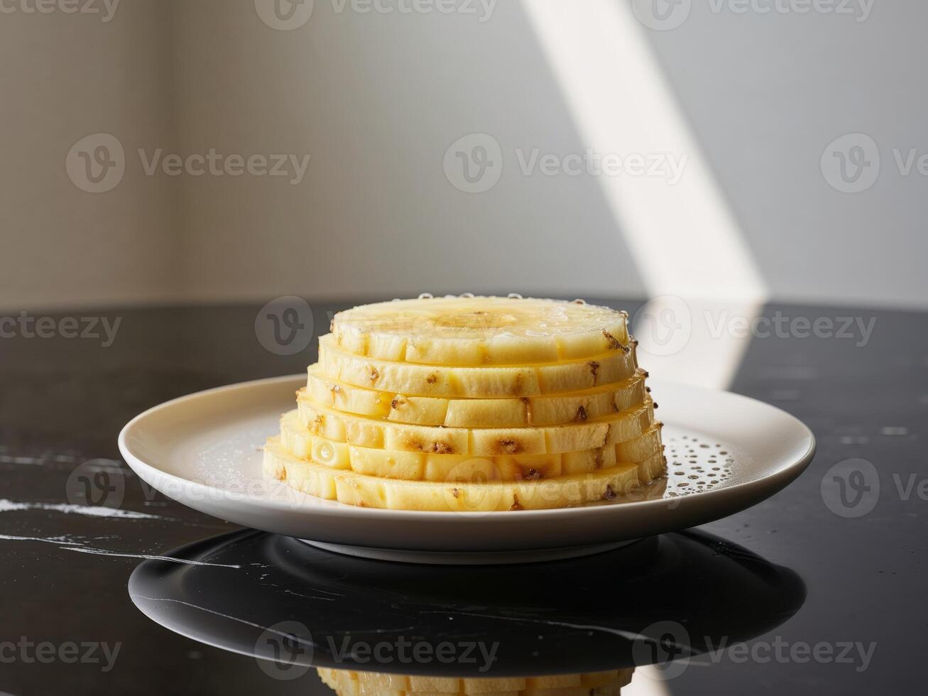 A stack of sliced pineapples on a plate photo