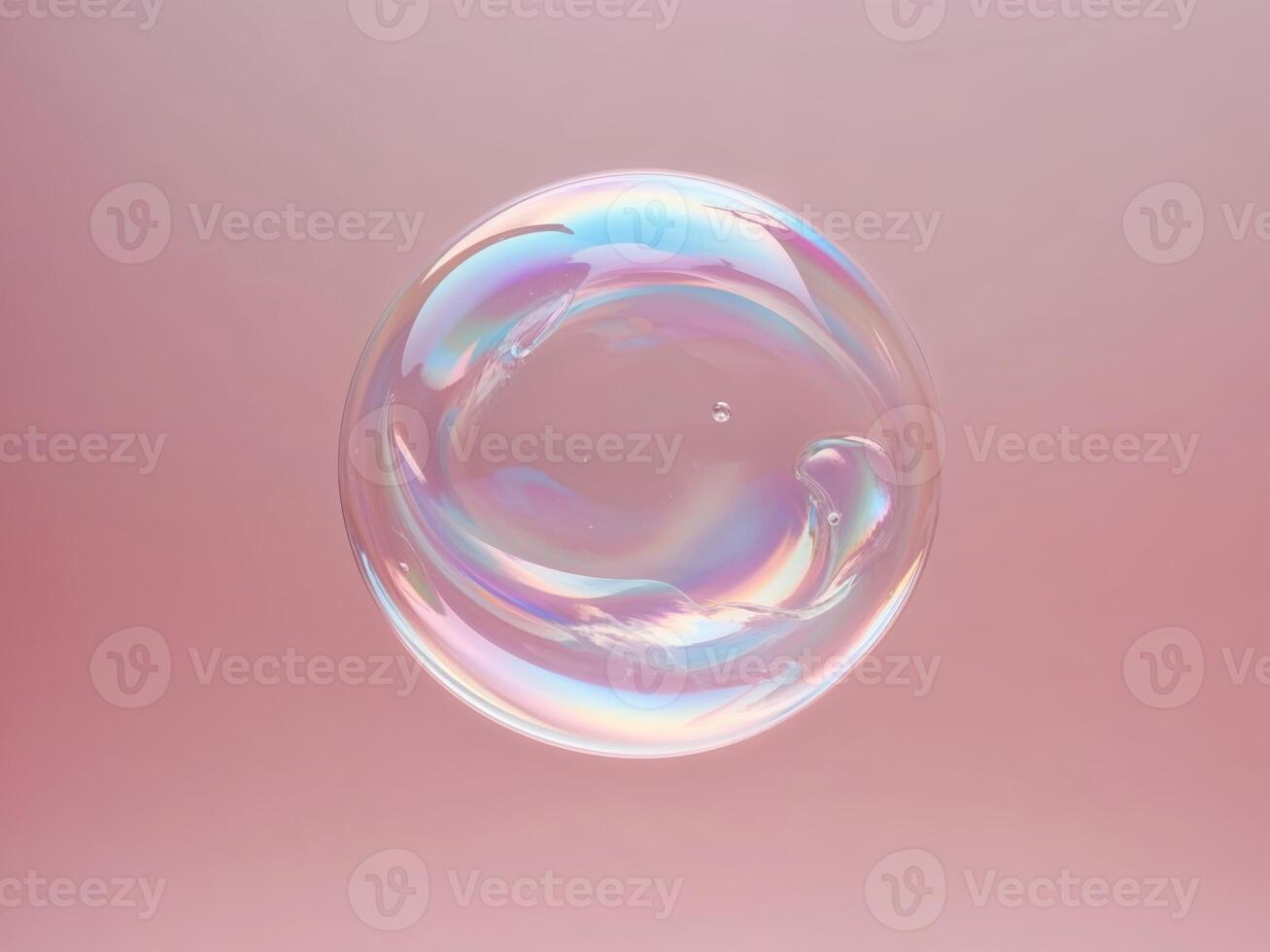 A bubble of soap floating in the air on a pink background photo