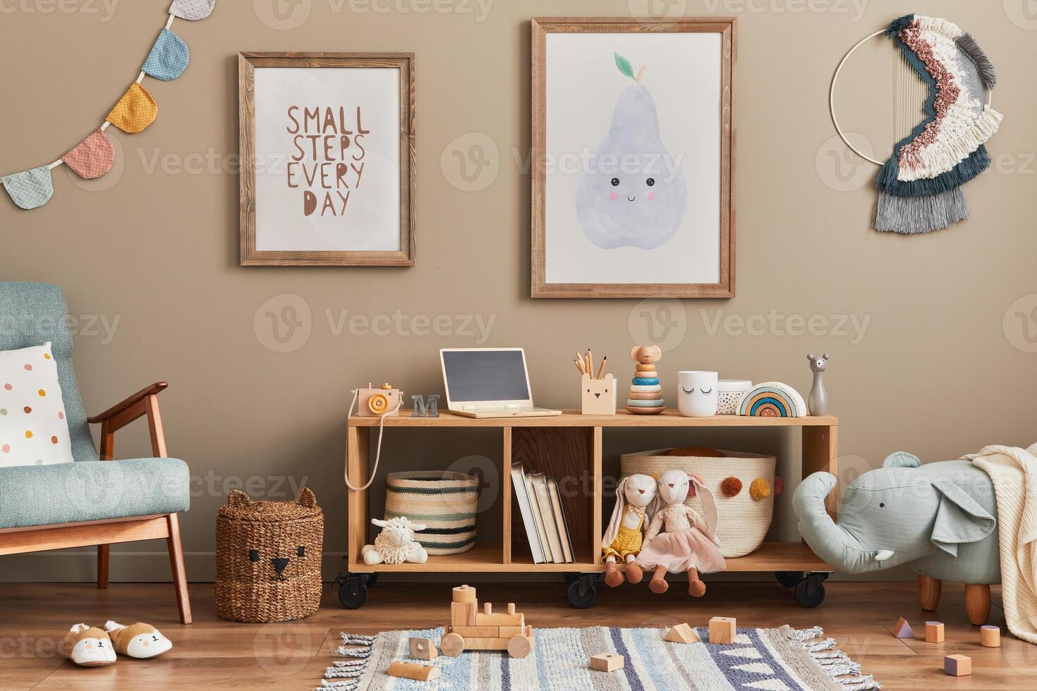 Stylish scandinavian kid room with toys, teddy bear, plush animal toys, mint armchair, furniture, decoration and child accessories. Brown wooden mock up poster frames on the wall photo